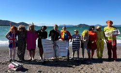 Yardıma muhtaç çocuklar ve hayvanlara destek için denize girdiler