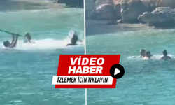 Denizin ortasında sopalı kavga
