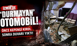 İzmir'de 'durmayan' otomobil... Önce kepengi kırdı, sonra duvarı yıktı!