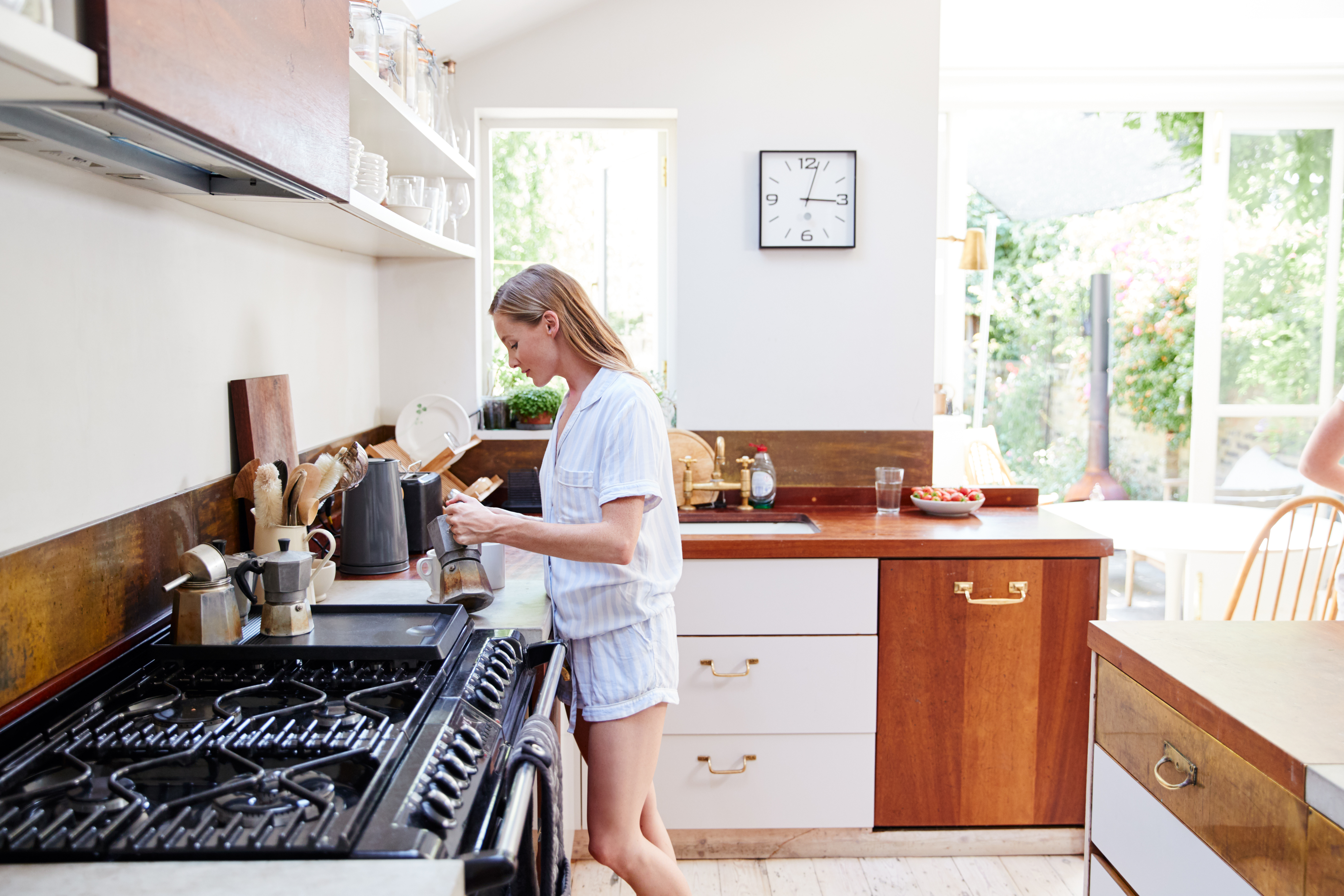 woman-wearing-pajamas-at-home-in-kitchen-making-fr-2022-02-08-22-39-27-utc